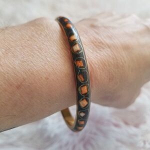 A Black Bangle w/painted orange shapes JEW-B1